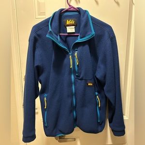 REI woman’s blue jacket